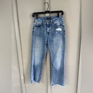 Distressed blue denim jeans, size 1/25, featuring a straight leg